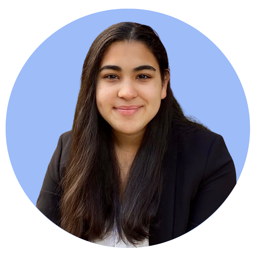Headshot of Fabiola Cruz with a light blue background.